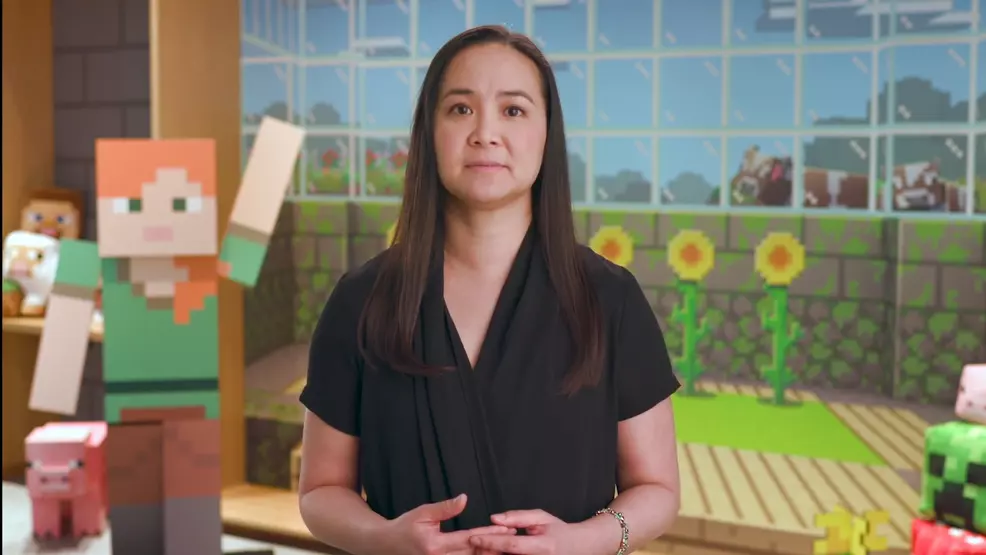 Helen Chiang speaking in front of a Minecraft backdrop
